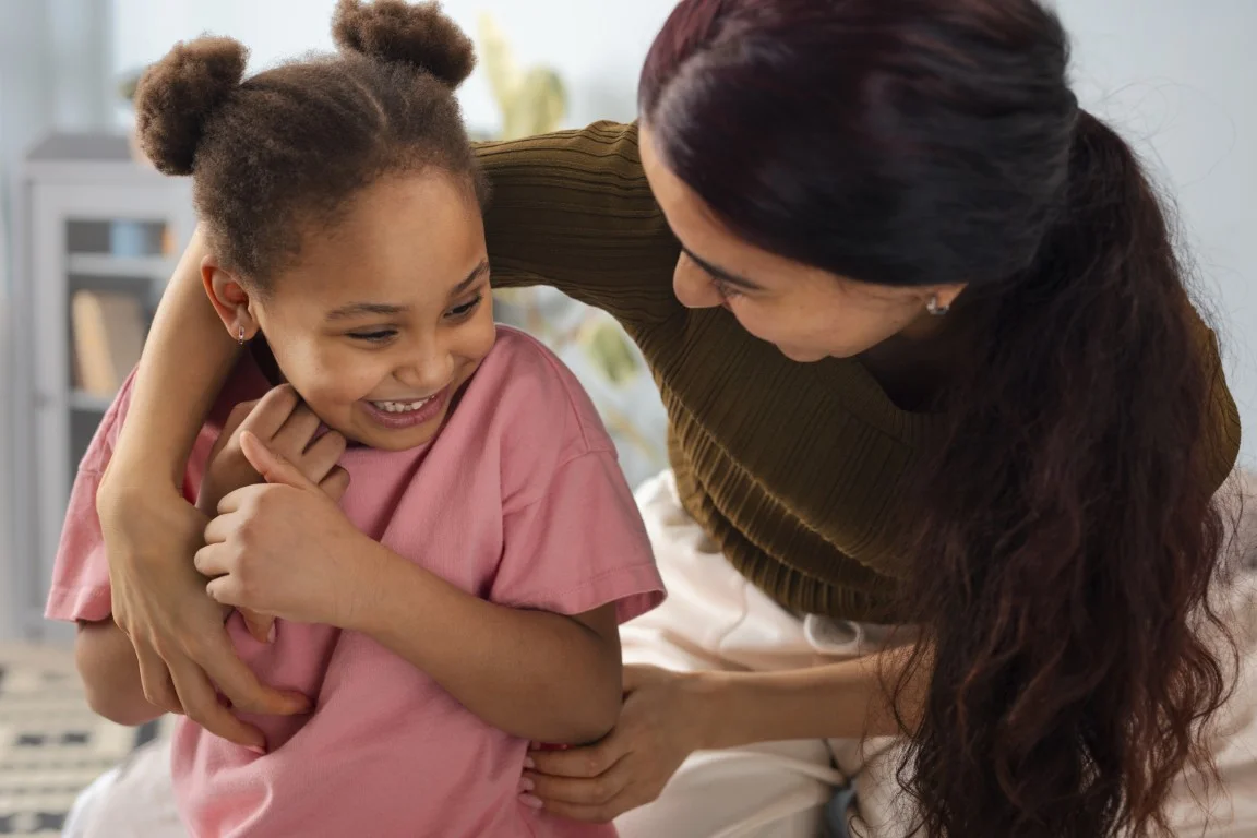 Parent and child smiling together, representing child support guidance and family law matters in California.